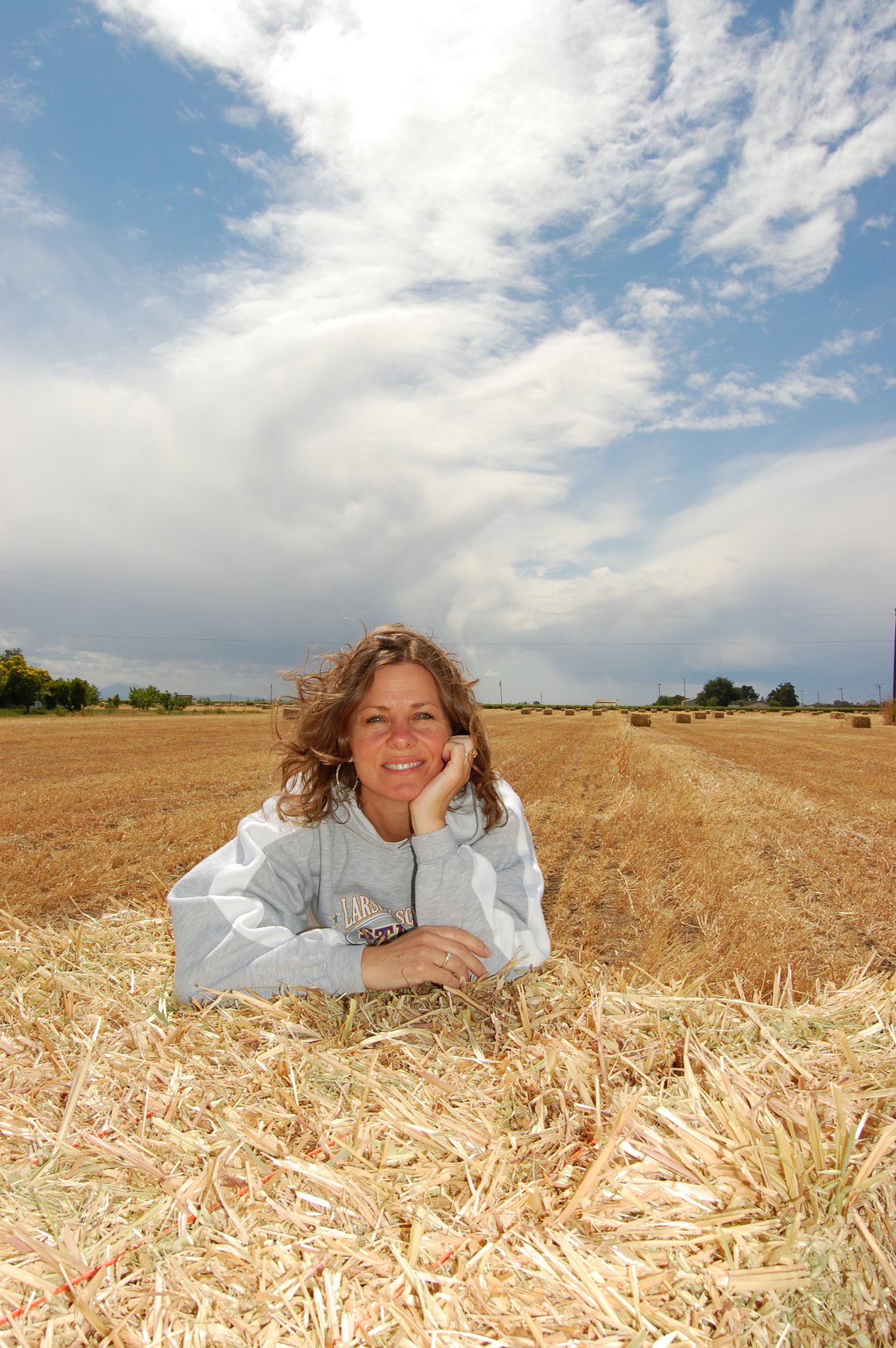 Jennifer saying hello from a bale of hay